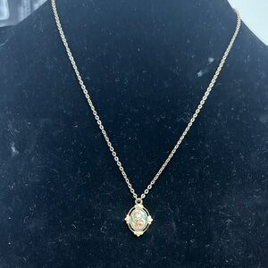 1928 Gold-Tone Enamel Floral Pendant Necklace with Blue and Orange Accents